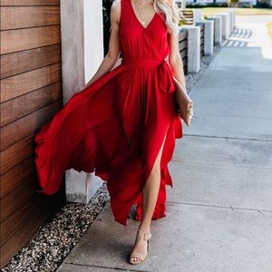 Floor-length red dress with side slits